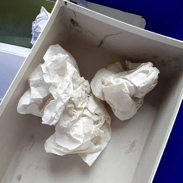 Box containing crumpled paper to mean a concept - Zdjęcie, obraz