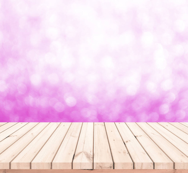 Wood table or wood floor with abstract pink bokeh background for product display - Photo, Image