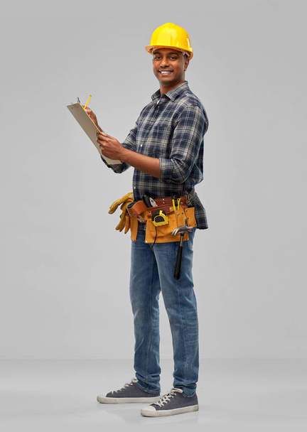 happy builder with clipboard and pencil - Fotoğraf, Görsel
