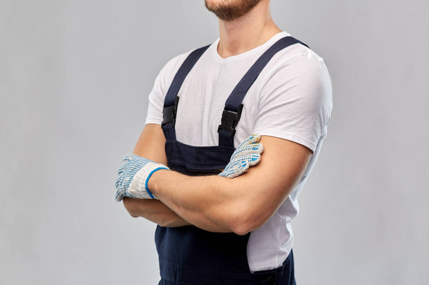 close up of male builder in overall and gloves - Zdjęcie, obraz
