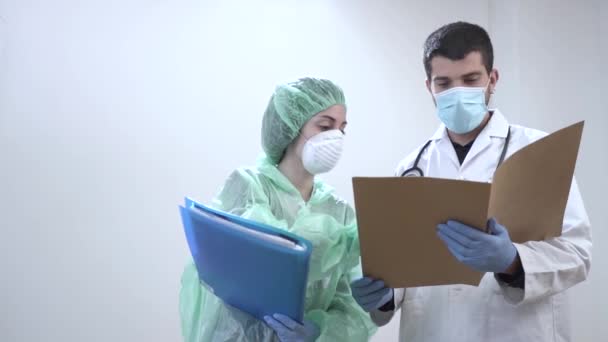 Coronavirus. Thank you doctors and nurses working in the hospitals and fighting the coronavirus. Doctors are heroes. Doctors in the protective suits and masks looking for a cure for the disease. - Filmati, video