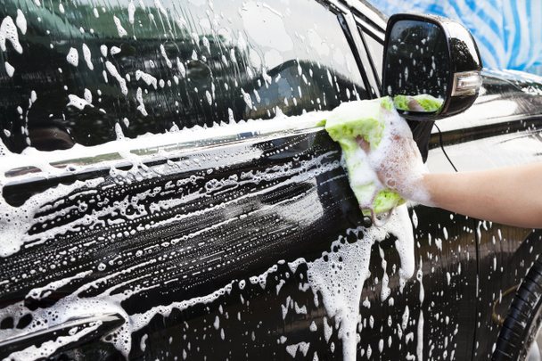 hands hold sponge for washing car - Photo, Image