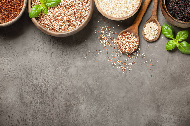 White, red, black and mixed quinoa on stone background - Photo, image