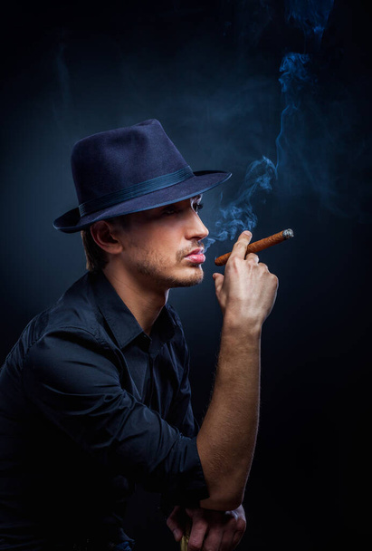 Gangster look. Handsome man with hat and cigar. - Φωτογραφία, εικόνα