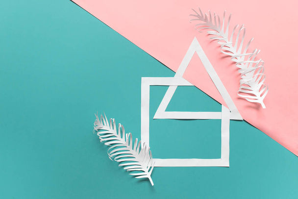 Geometric composition with white paper triangle, square shapes and two paper plant branches feathers on pink blue  background. Photo with copy blank space. - Photo, image