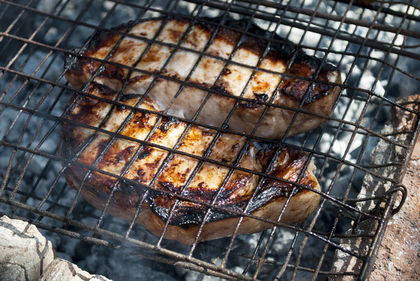 Beautiful, juicy pork steaks on fire. - Photo, Image