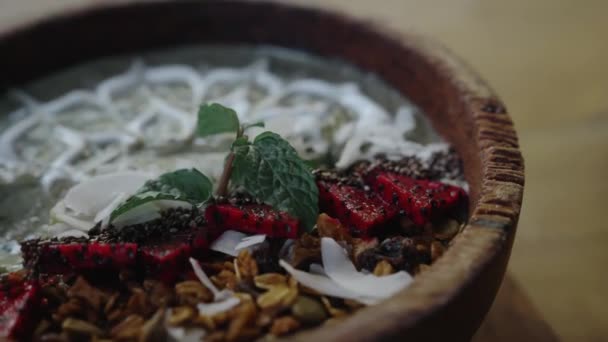 Eating Healthy Green Smoothie Bowl on Breakfast With Spoon. Concept: Healthy Breakfast, Clean Eating, Detox, Diet, Plant-based Food, Vegan, Vegetarian. - Metraje, vídeo