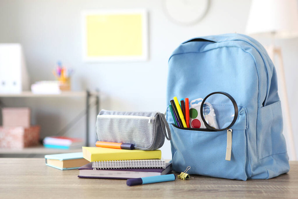 school backpack and stationery in a bright room. Preparing for school. Back to school. Place for text. National School Backpack Awareness Day - Foto, Imagen