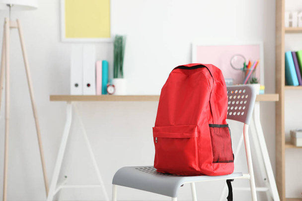 school backpack and stationery in a bright room. Preparing for school. Back to school. Place for text. National School Backpack Awareness Day - Фото, изображение
