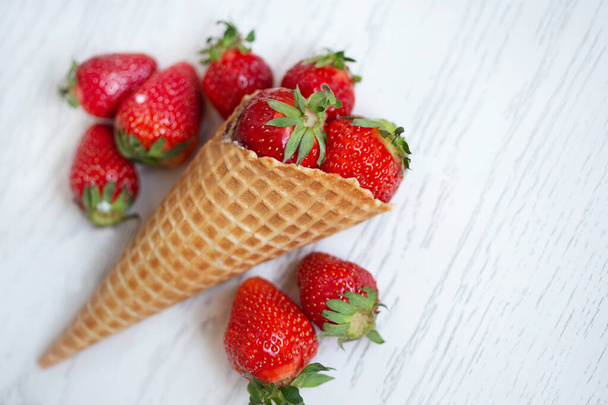 strawberries in a waffle cone - Фото, изображение