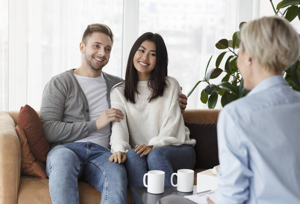 Cheerful Family Couple Talking With Counselor Sitting In Office - Photo, image