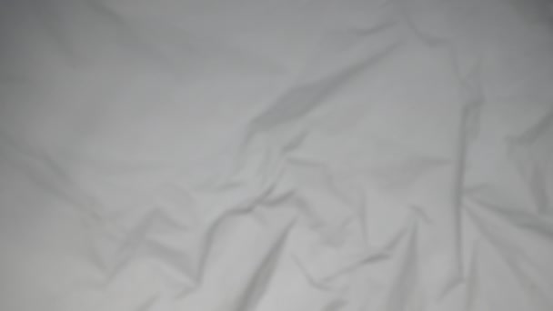 Texture of crumpled white fabric background. - Footage, Video
