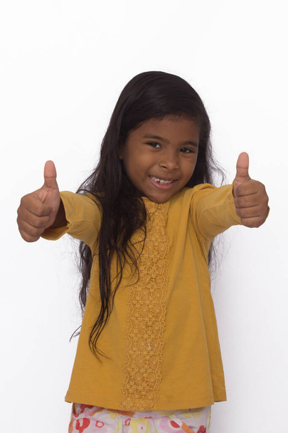 black girl in yellow shirt playing, photo with white background - Photo, Image