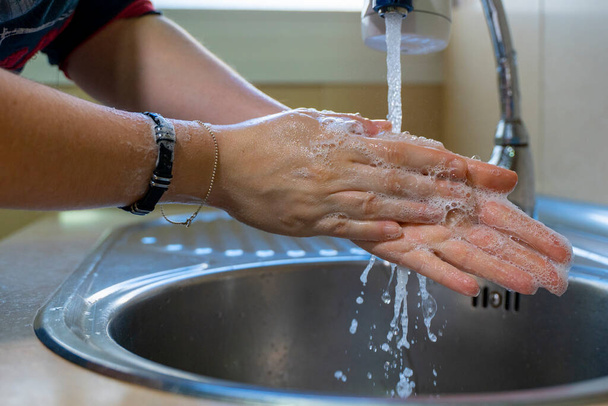Washing hands properly. Hygiene concept. Rubbing with soap and water. - Fotoğraf, Görsel