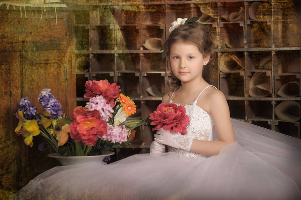 little girl princess in elegant white vintage dress with a bouquet of flowers - Fotoğraf, Görsel