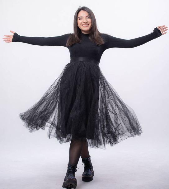 Happy beautiful woman in blue dress posing in studio isolated on white background,black long boots on his feet, Full length portrait,opened her arms smiling, - Φωτογραφία, εικόνα