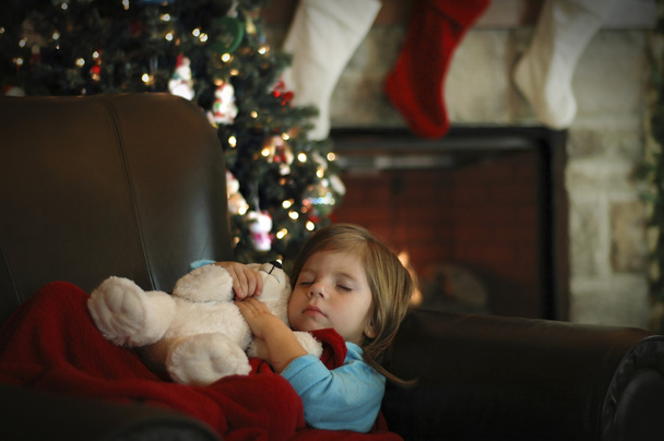 Pieni tyttö nukkuu ennakoiden joulua
 - Valokuva, kuva