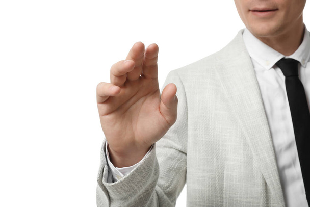 Businessman touching something on white background, closeup - Фото, изображение