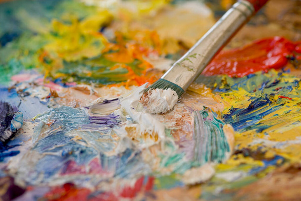 Artists oil paints and brush multi coloured close up semi abstract - Photo, Image