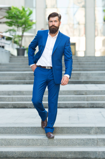 Business people. On his way to success. Walking down street. Mature hipster with beard on stairs. Bearded man in business centre. Confident brutal man walk street. Businessman in formal clothes - Фото, зображення