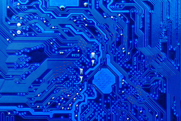 blue circuit board background of computer motherboard,Electronic computer hardware technology.Integrated communication processor. Information engineering component. Blue color. - Photo, Image