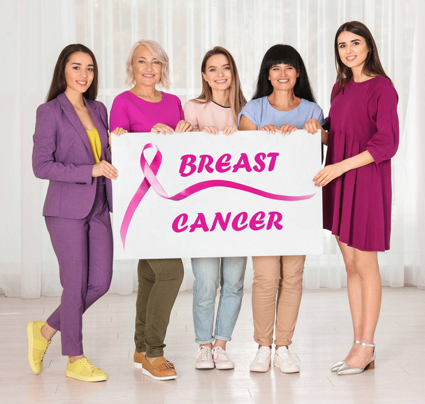 Group of women holding poster with text BREAST CANCER indoors - Fotoğraf, Görsel