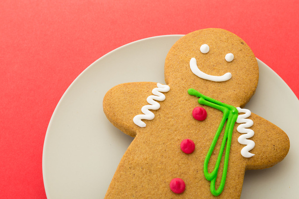 Gingerbread man on red background - Photo, Image