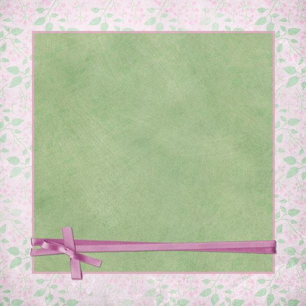 Pink ribbon wrap on green background - Фото, изображение