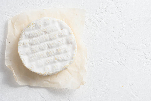 Neufchatel cheese and a Camembert cheese of Normandy on white stone surface top view space for text. - Photo, Image