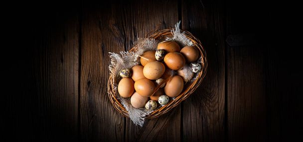 Fresh eggs straight from the farm in a basket - Фото, изображение