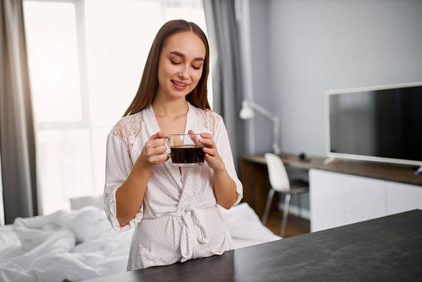 cute woman drinking coffee at home - Zdjęcie, obraz