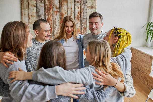 people hugging at meeting of a support group - Foto, imagen