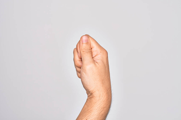 Рука білого чоловіка, що показує пальці над ізольованим білим тлом, тримає порожній простір пальцем, бізнесом та рекламою
 - Фото, зображення