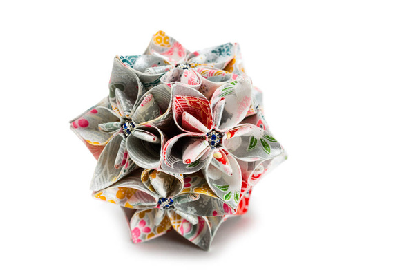 Origami Japan traditiona art in the shape of a ball - Kusudama isolated on white - Φωτογραφία, εικόνα