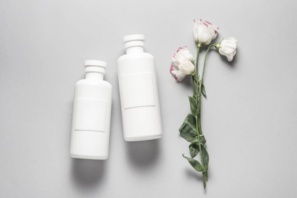 Set of plastic shampoo, cosmetics bottles on grey background - Foto, Bild