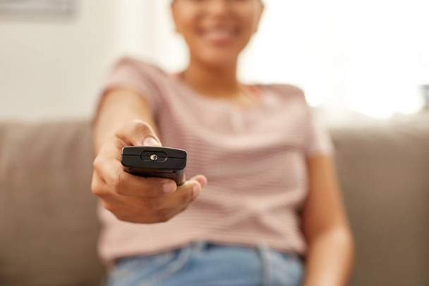 happy african american woman watching tv at home - Photo, Image