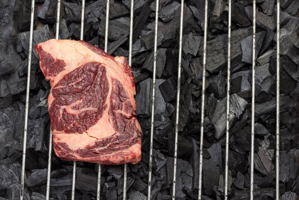 Raw meat. Marbled beef steak on grill. Natural source of protein. Organic food. Flat lay - Foto, immagini