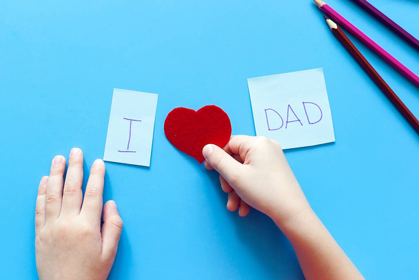 happy father's day cute dad and daughter hugging on colored yellow background - 写真・画像