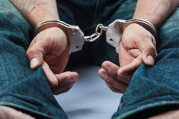 Prisoner locked in handcuffs - Photo, Image