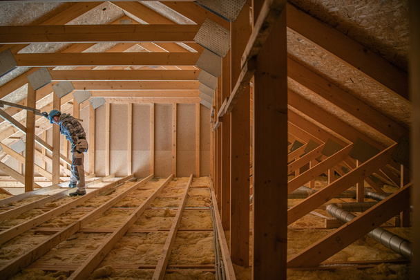 Construction Worker Looking Downstairs. Attic Wooden Roof Construction. House Cover. Wooden Structure. - Photo, Image