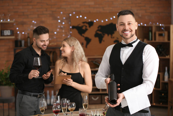 People tasting wine at the restaurant - Фото, изображение
