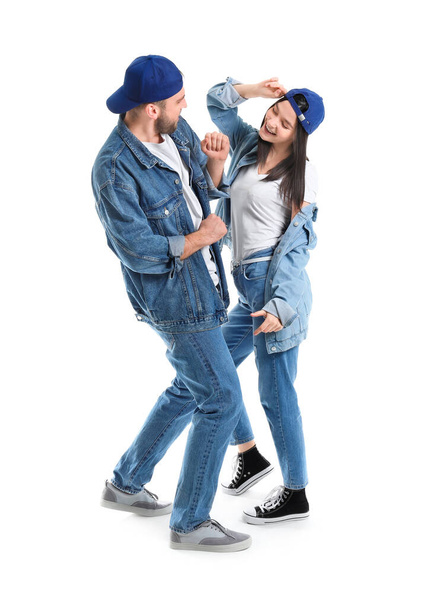 Happy young couple dancing against white background - Photo, Image