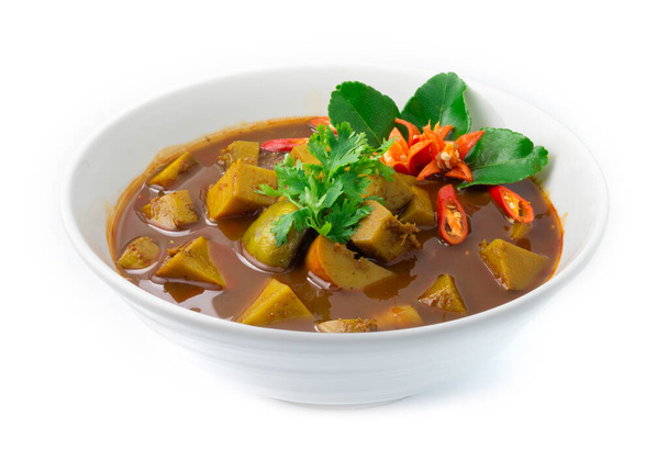 Thai Fish Organs Sour Curry Soup with Long Bean, Bamboo shoot, eggplants cutlet Thai foods Southern style decorate with Kaffer lime leaf and chili drawed side view - Фото, зображення