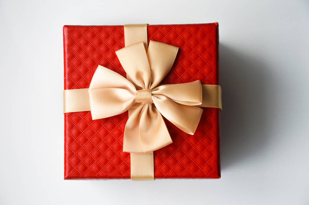 Red box with a big bow. Packing for a gift. - Foto, imagen