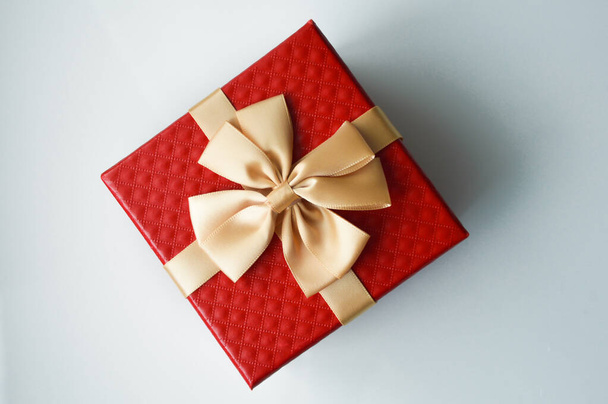 Red box with a big bow. Packing for a gift. - Foto, imagen