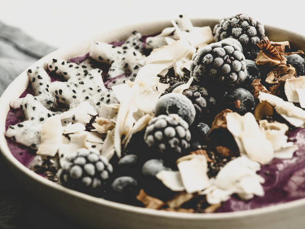 Smoothie bowl with berries and coconut flakes - Foto, imagen
