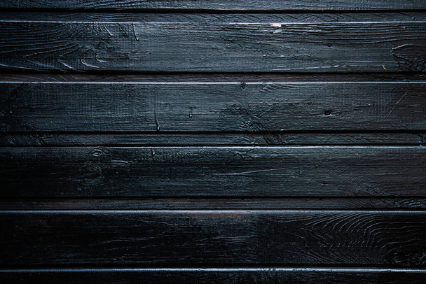 background of parallel wooden boards, black color, place for text - Foto, Imagem
