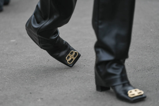 Paris, France - February 28, 2020: Black leather high heel boots detail - streetstylefw20 - Foto, Bild