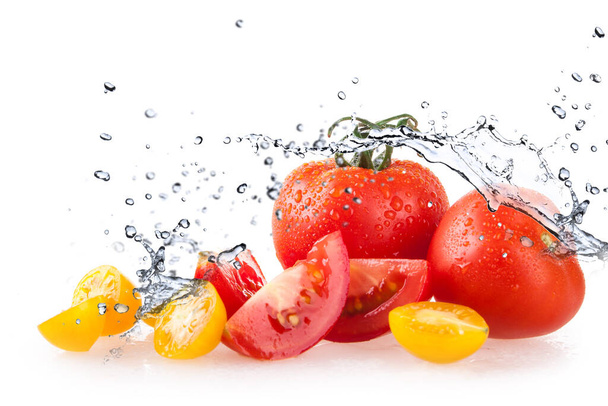 tomatoes on white background and water splash and drops - Foto, Imagem