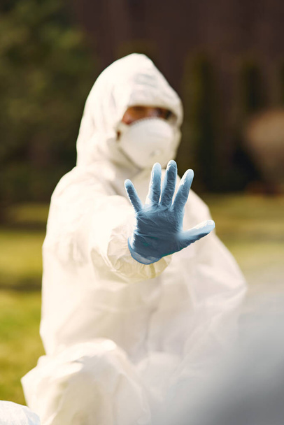 Person in a protective suit in a park - Photo, image